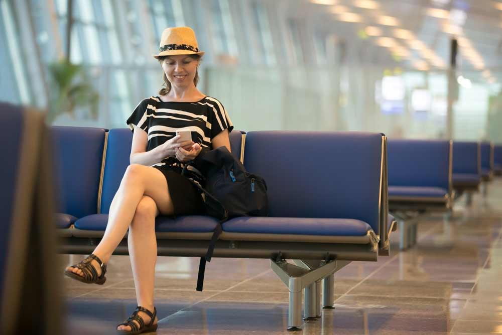 Woman connected to the Wi-Fi in airport